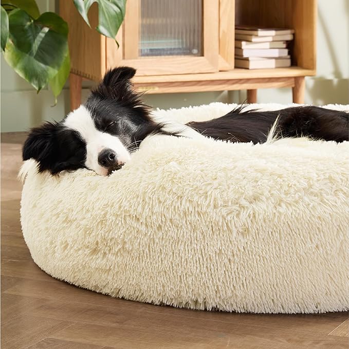 Bedsure Calming Dog Bed for Large Dogs - Donut Washable Large Pet Bed, Anti-Slip Round Fluffy Plush Faux Fur Dog Bed, Fits up to 100 lbs Pets, Oat Milk, 36 inches